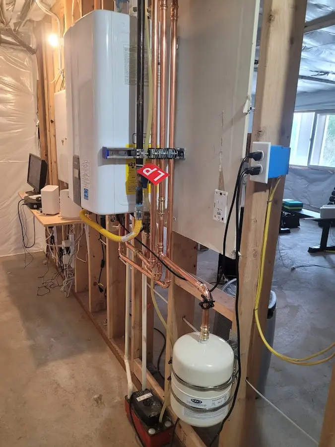 Licensed plumber repairing a kitchen sink in Brookmont